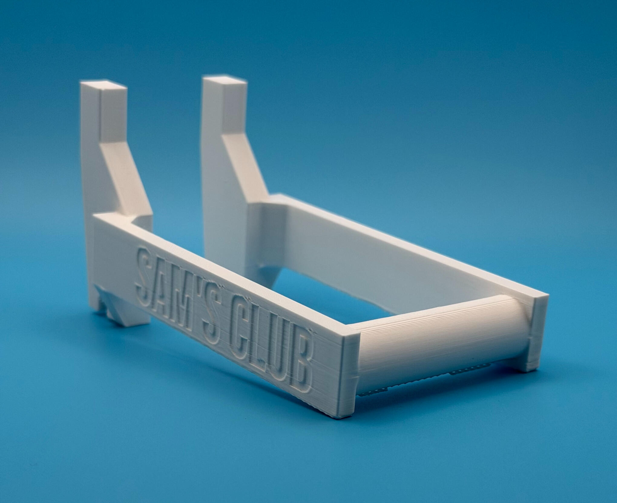 The holder installed on shelving with labels loaded